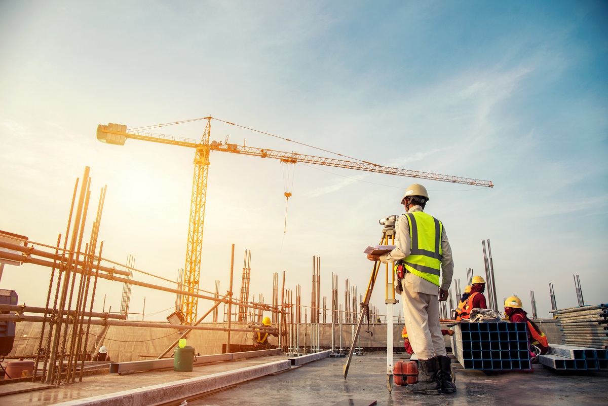 Construction worker surveying the site