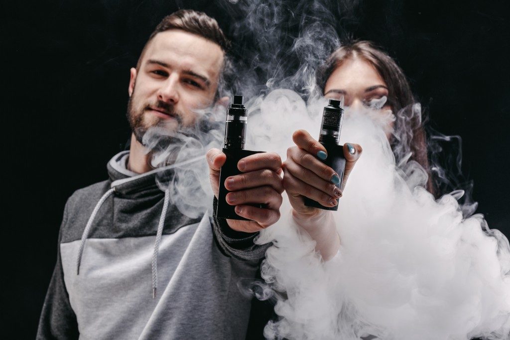 Couple in a cloud of vape