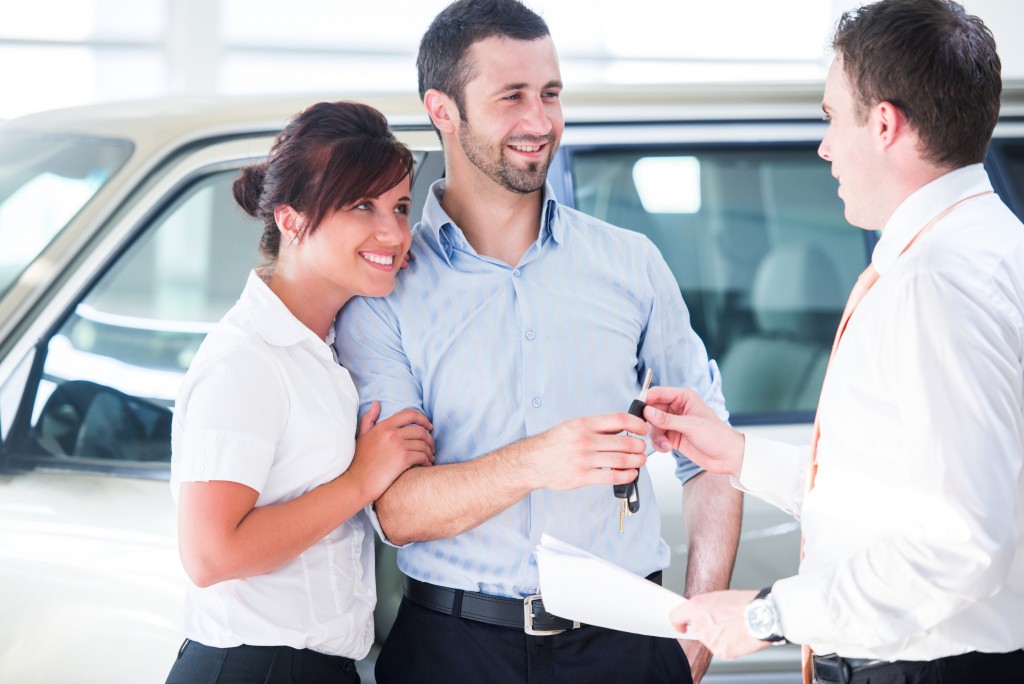 Couple buying a new car