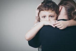 Child hugging mother