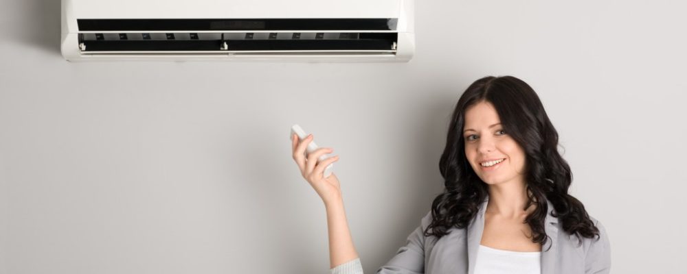 woman satisfied with her air conditioner