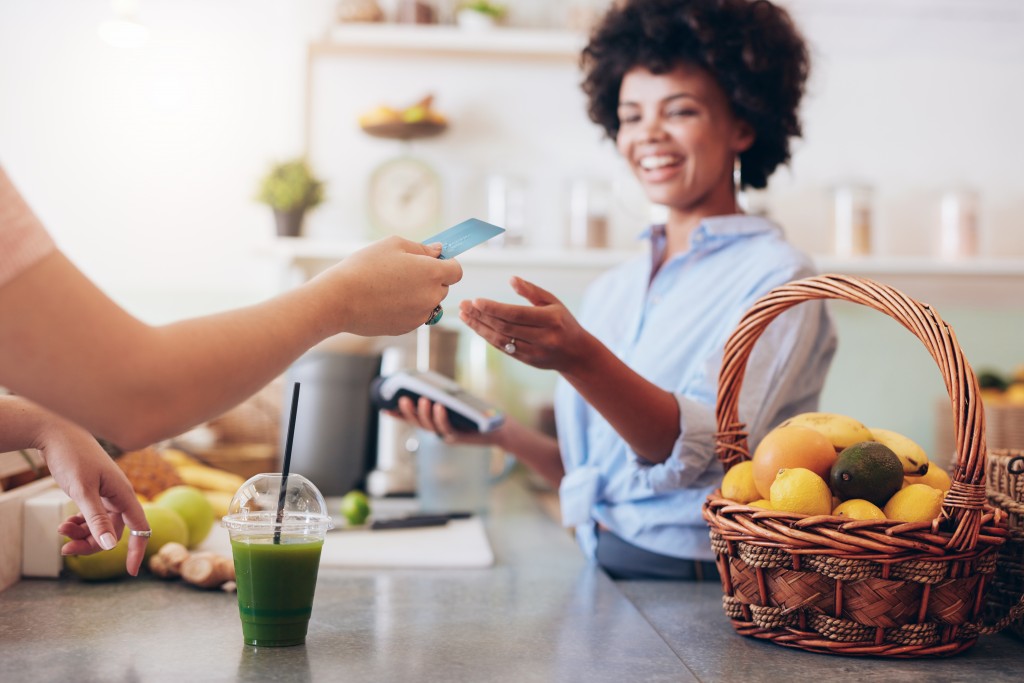 Woman accepting payment from customer