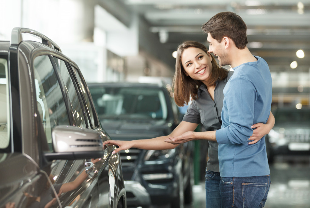 Couple looking at a new car