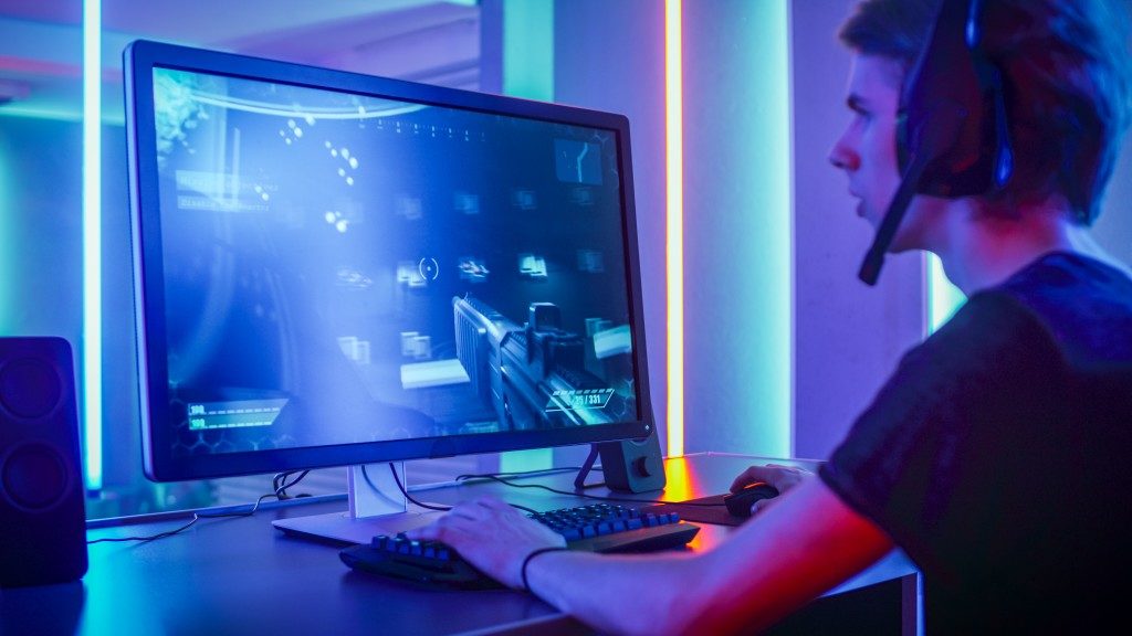 guy playing on his gaming PC