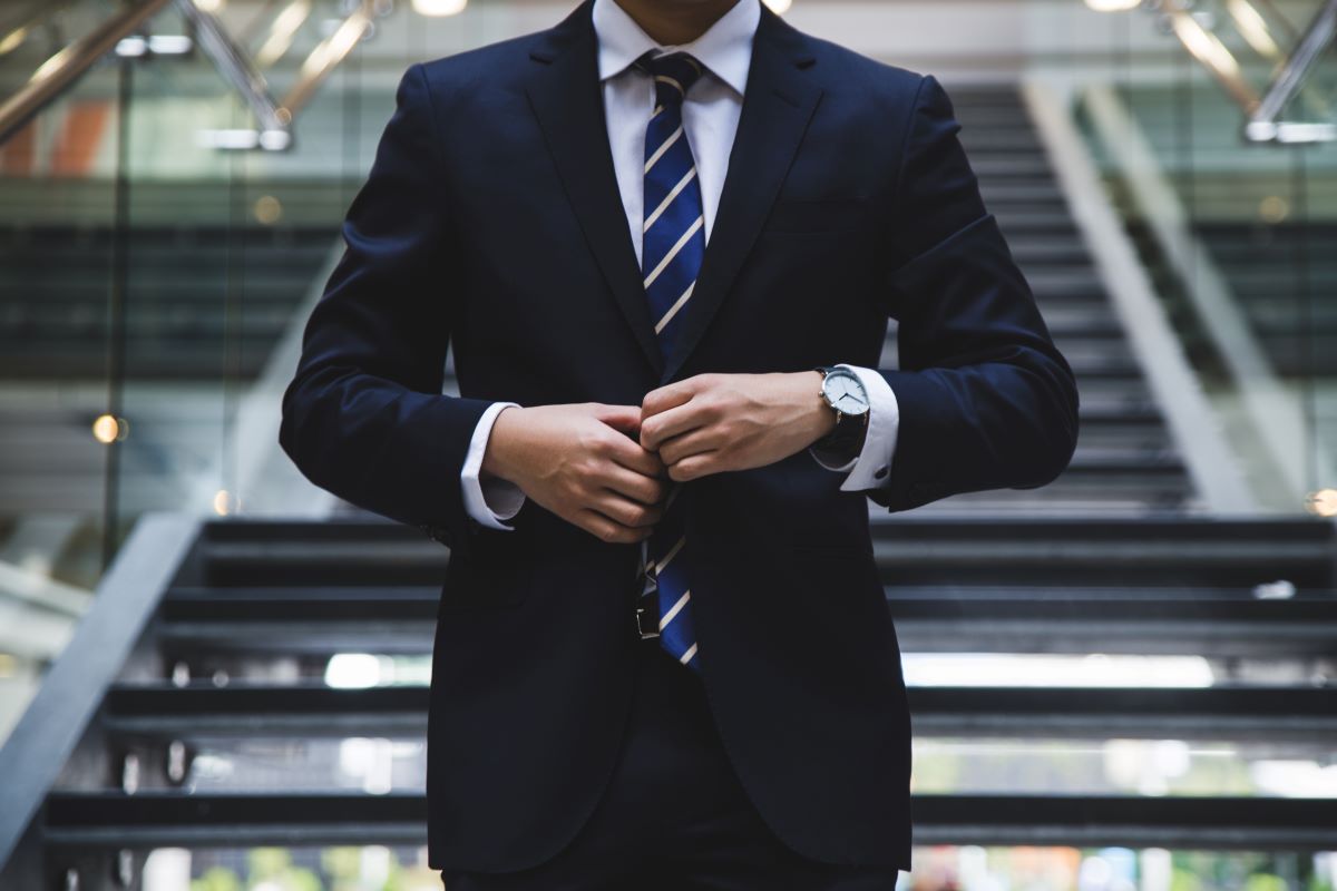 businessman adjusting his suit