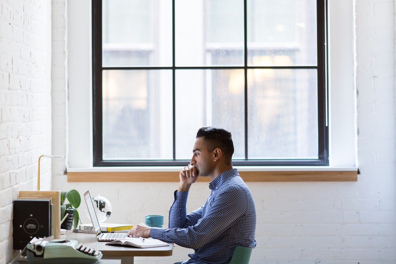 man using his computer