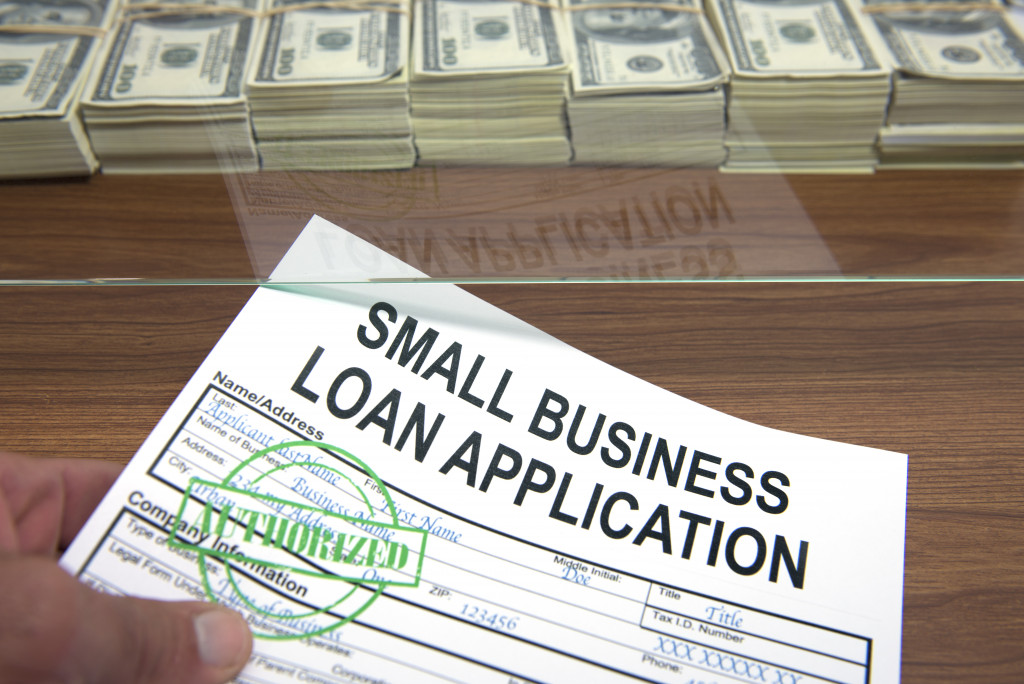small business loan application with approved stamp