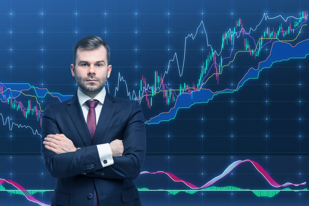 business man standing with finance data background